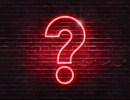 a neon sign with a question mark on it